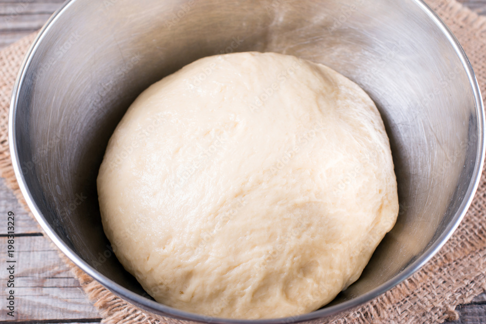 Raw dough in a bread baking dish Raw dough in a bread baking dish