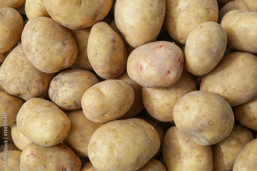 Crate of fresh potatoes on farmers market Crate of fresh potatoes on farmers market