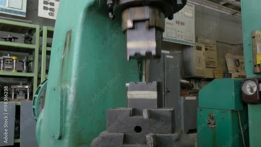 Hammering machine at work. Metal press machine.
Hammering machine at work. Metal press machine.