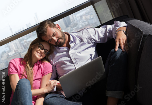 couple relaxing at  home using laptop computers © .shock
