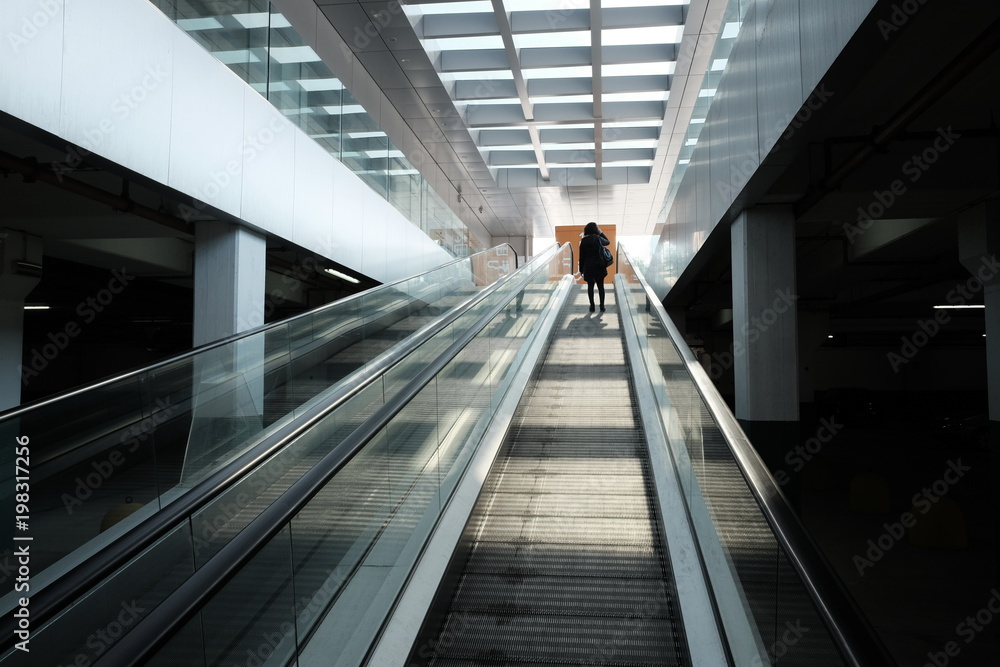woman on the escalator shopping mall woman on the escalator shopping mall