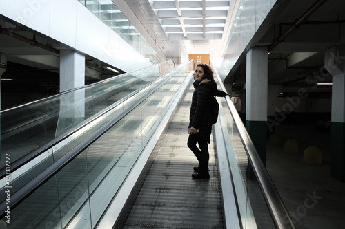woman on the escalator shopping mall