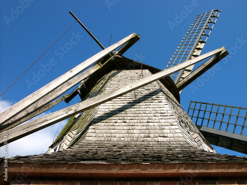 Die alte Sinninger Mühle aus der Froschperspektive vor strahlend blauem Himmel bei Sonnenschein in Sinningen bei Saerbeck im Kreis Steinfurt in Westfalen im Münsterland photo