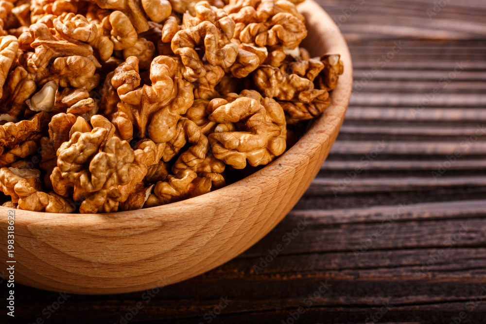 Walnut on a dark rustic wooden background Walnut on a dark rustic wooden background