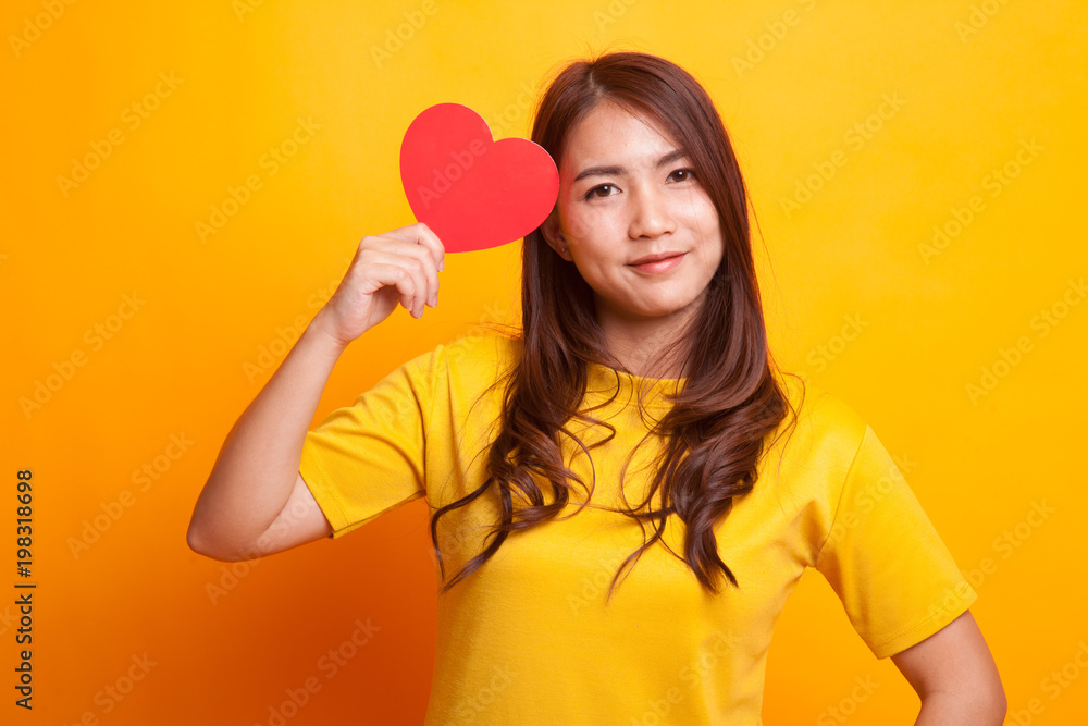 Asian woman with red heart. Asian woman with red heart.
