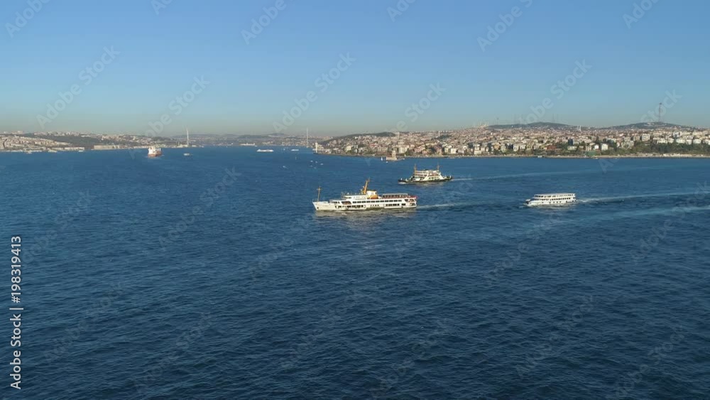 Ships floating Bosphorus blue water sunny day. Aerial drone view on sunset in Istanbul, Turkey Ships floating Bosphorus blue water sunny day. Aerial drone view on sunset in Istanbul, Turkey