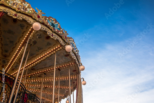 French carousel orleans against blue sky © VladFotoMag