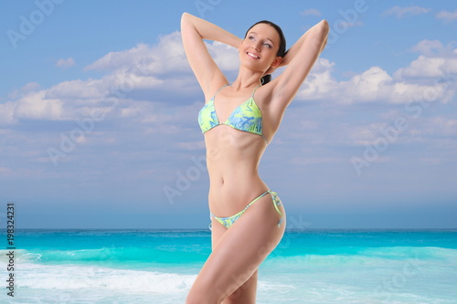 girl in bikini is resting on the sea