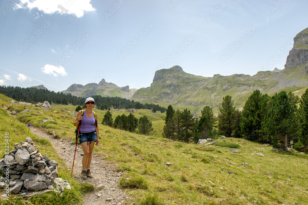 mature woman hiking in the Pyrenees mountains