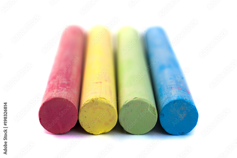 Colored chalks on white background with soft shadows Colored chalks on white background with soft shadows