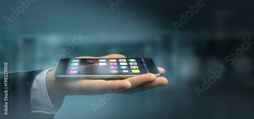 Hands on the dark holding a smartphone