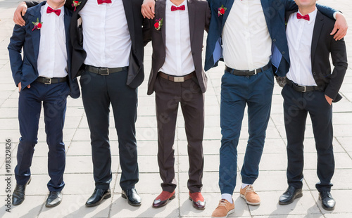 Groom and his friends pose in a restaurant photo