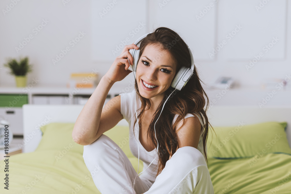 Cheerful girl relaxing at home