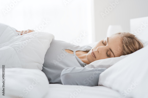 Young woman sleeping in the bedroom