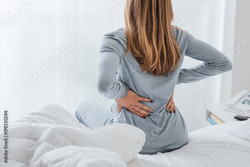 Woman with back ache photo