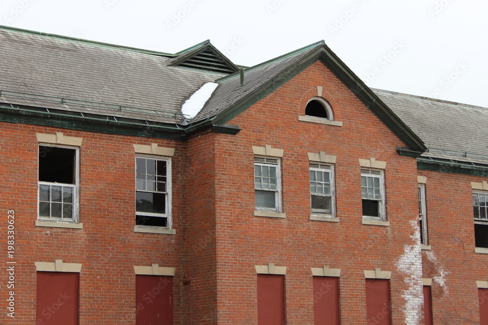 Exterior of old brick abandoned historical mental asylum facility