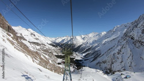 Cabin of the cableway passes a pillar