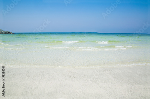 Summer beach background. White beach and green sea background. Nature background. © Nataliia