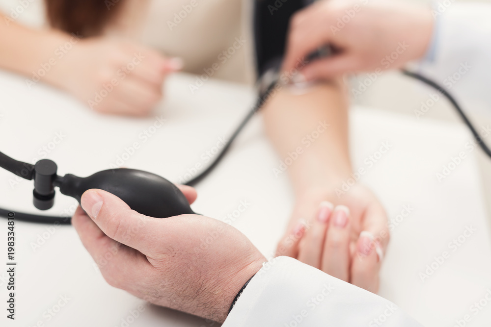 Closeup of doctor hand using tonometer Closeup of doctor hand using tonometer