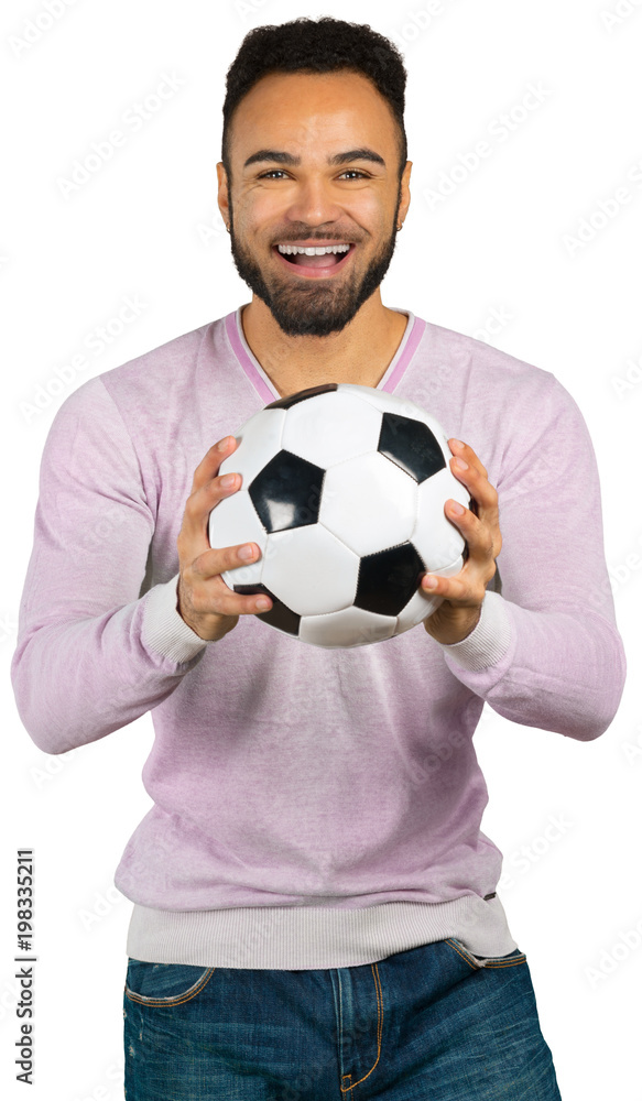 Happy smiling african man showing football