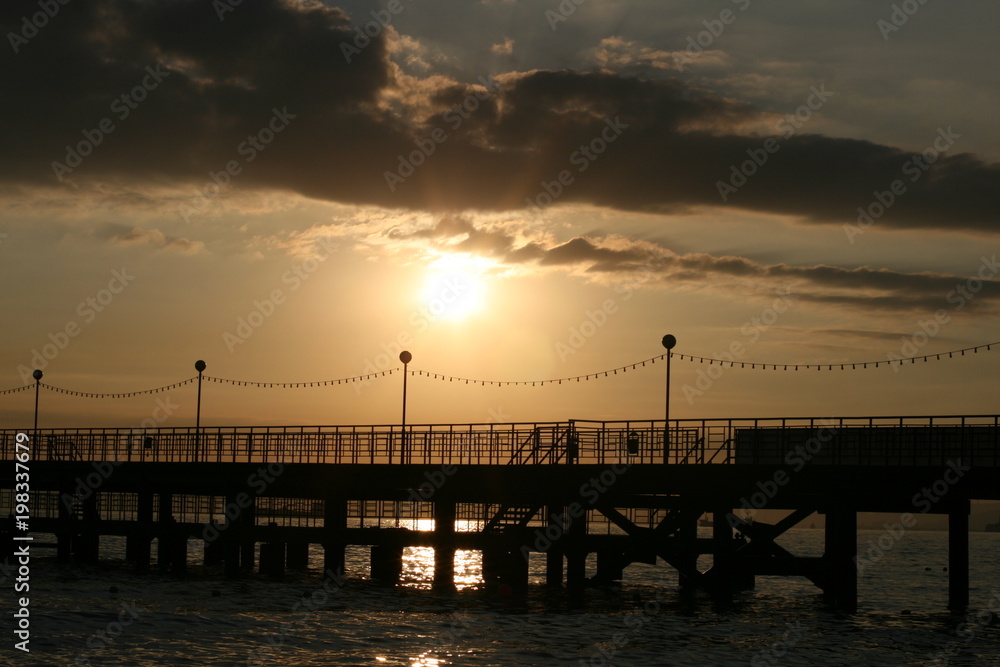sunset pier sea water