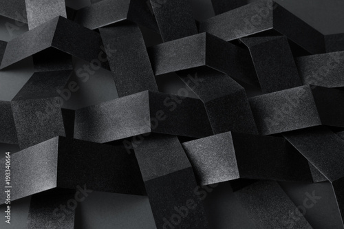 Conceptual composition with black geometric shapes, abstract background