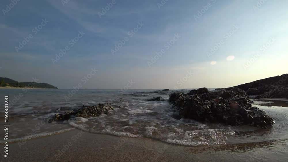 Beautiful low angle shot of the sea waves near shore splashes in camera. Beautiful low angle shot of the sea waves near shore splashes in camera.