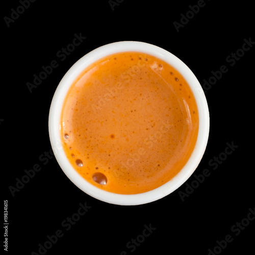 Carrot juice, fresh healthy drink. Top view, closeup. Isolated on black.