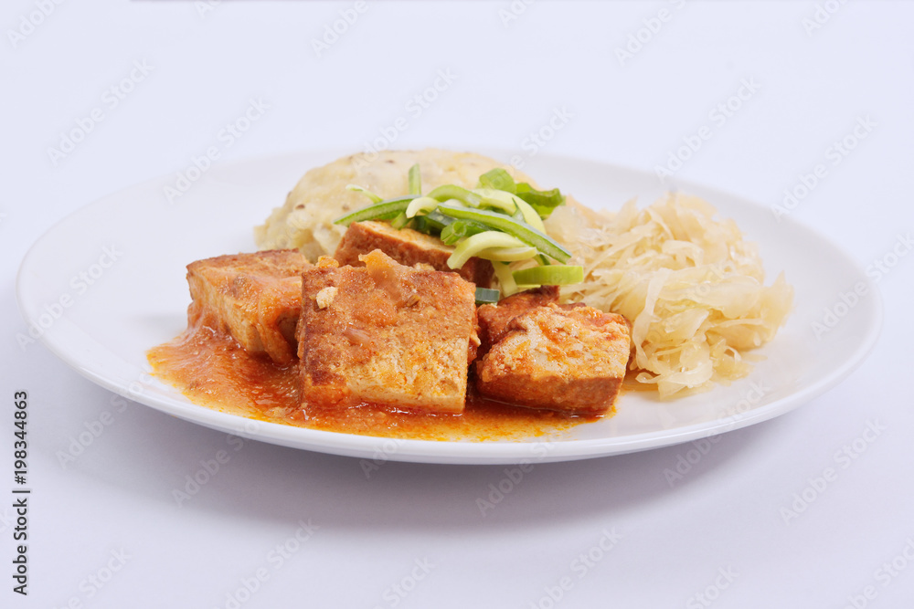 Tofu with cabbage and rice dumplings on a white Tofu with cabbage and rice dumplings on a white