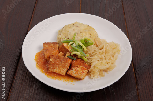 Tofu with cabbage and rice dumplings  on a table