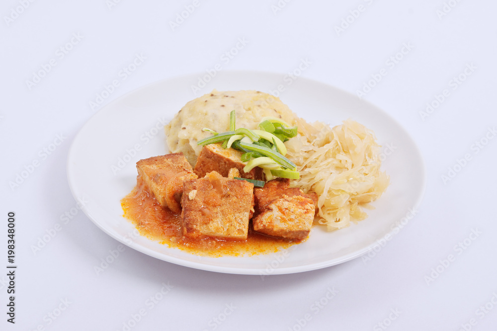 Tofu with cabbage and rice dumplings  on a white