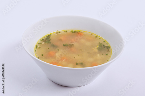 Tasty bread soup with vegetables on a white