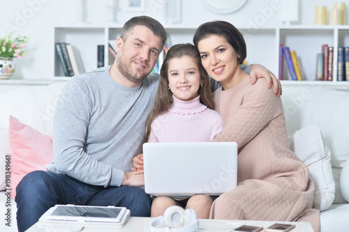 Happy family with laptop