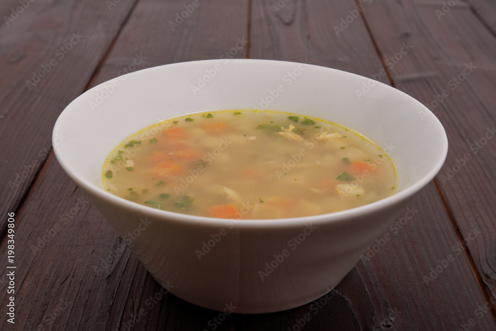 Tasty bread soup with vegetables on a table