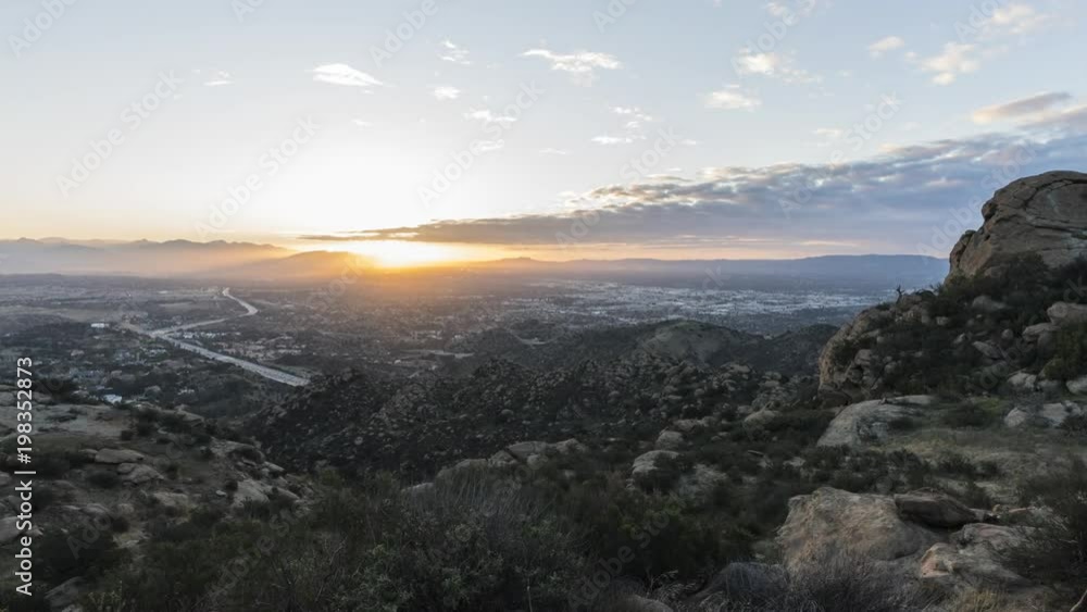 Sunrise time lapse with zoom in towards Porter Ranch in the San Fernando Valley area of Los Angeles California. View from Rocky Peak Park in the Santa Susana Mountains. Sunrise time lapse with zoom in towards Porter Ranch in the San Fernando Valley area of Los Angeles California. View from Rocky Peak Park in the Santa Susana Mountains.
