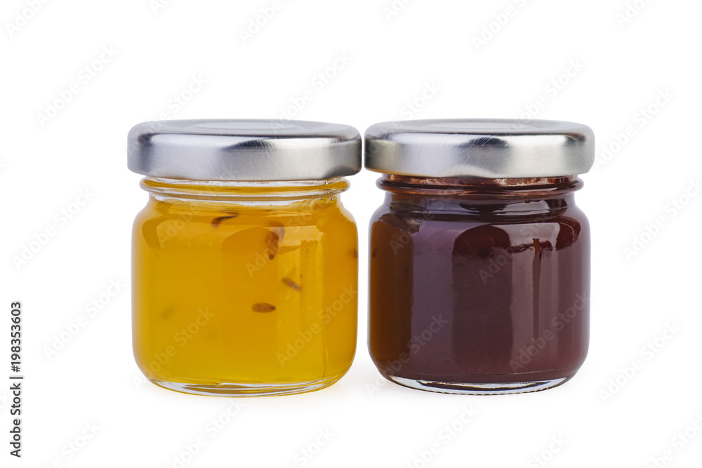 Glass jar with orange and plum jam Glass jar with orange and plum jam