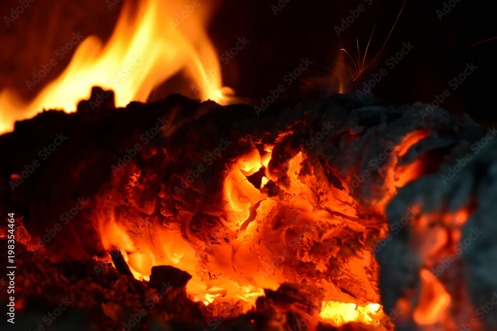 Fire in the fireplace, flames from burning coals on fire Fire in the fireplace, flames from burning coals on fire