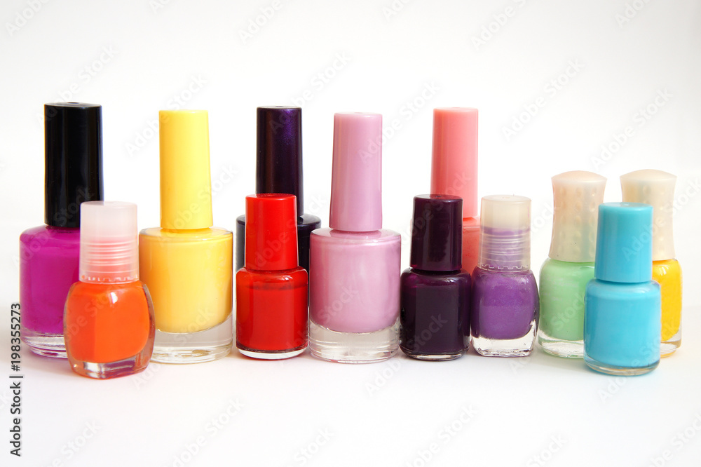 jars with nail varnish of different color and the size on a white background jars with nail varnish of different color and the size on a white background