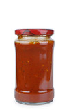 Glass bottle with piquant tomato sauce