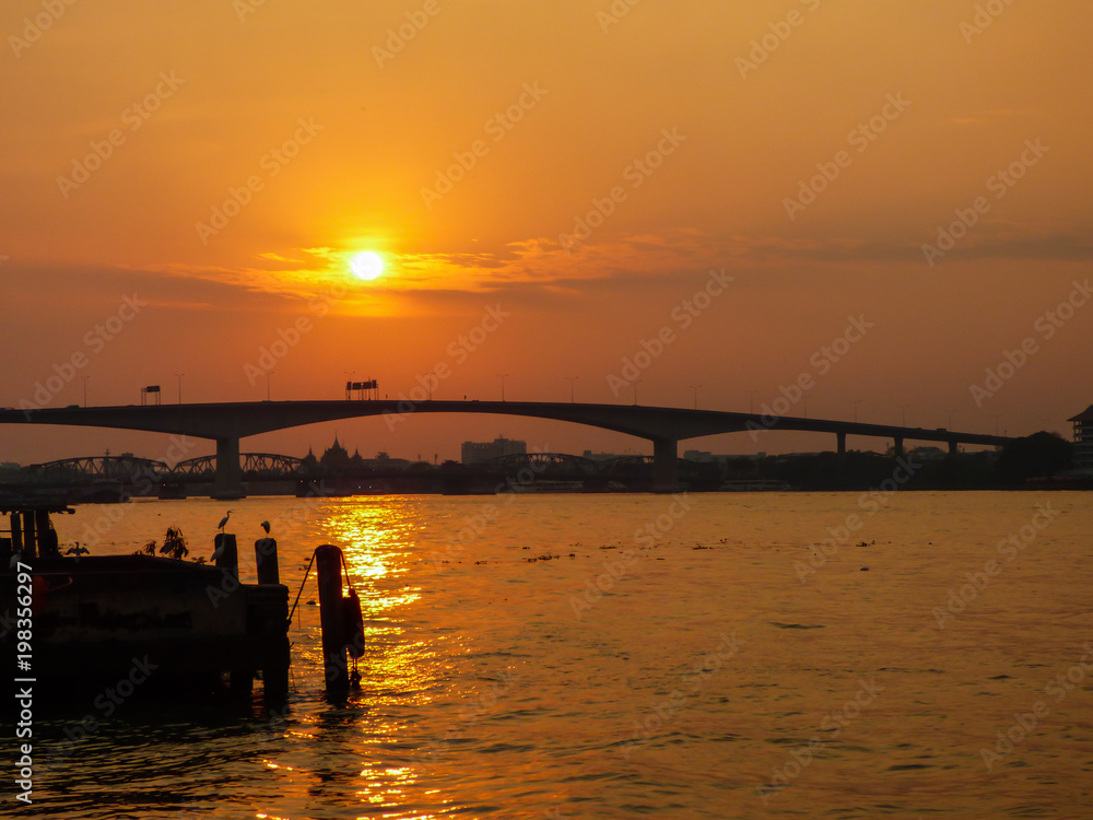 Sunset over Rama III bridge - view from Asiatique (Bangkok, Thailand)