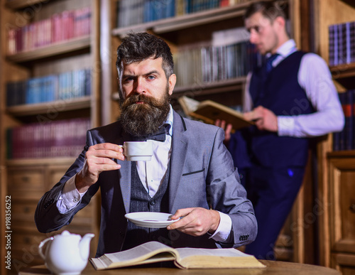 Fotografie Retro detectives work on investigation in antique room.
