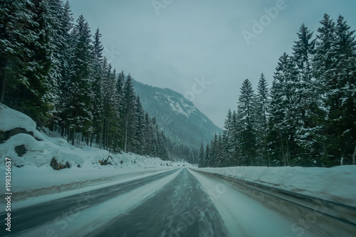 View of winter road snow and ice in the forest of Norway © Fotos 593