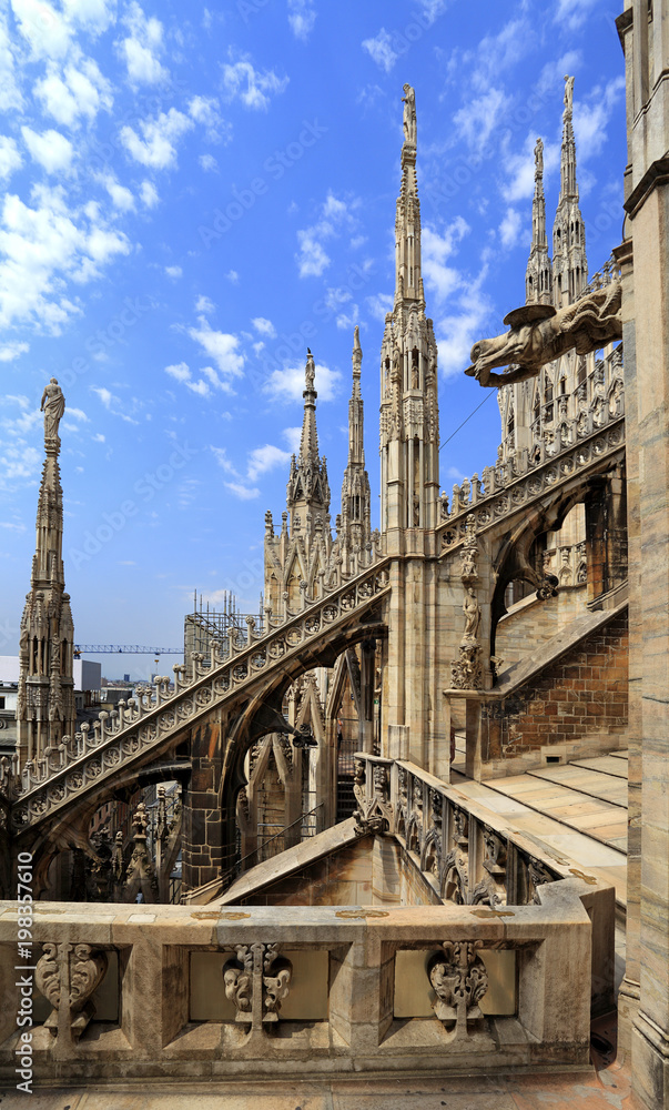 Milan, Italy - Roof architecture of the Cathedral of St. Mary Nascente - Duomo Santa Maria Nascente di Milano at Piazza del Duomo - Cathedral Square