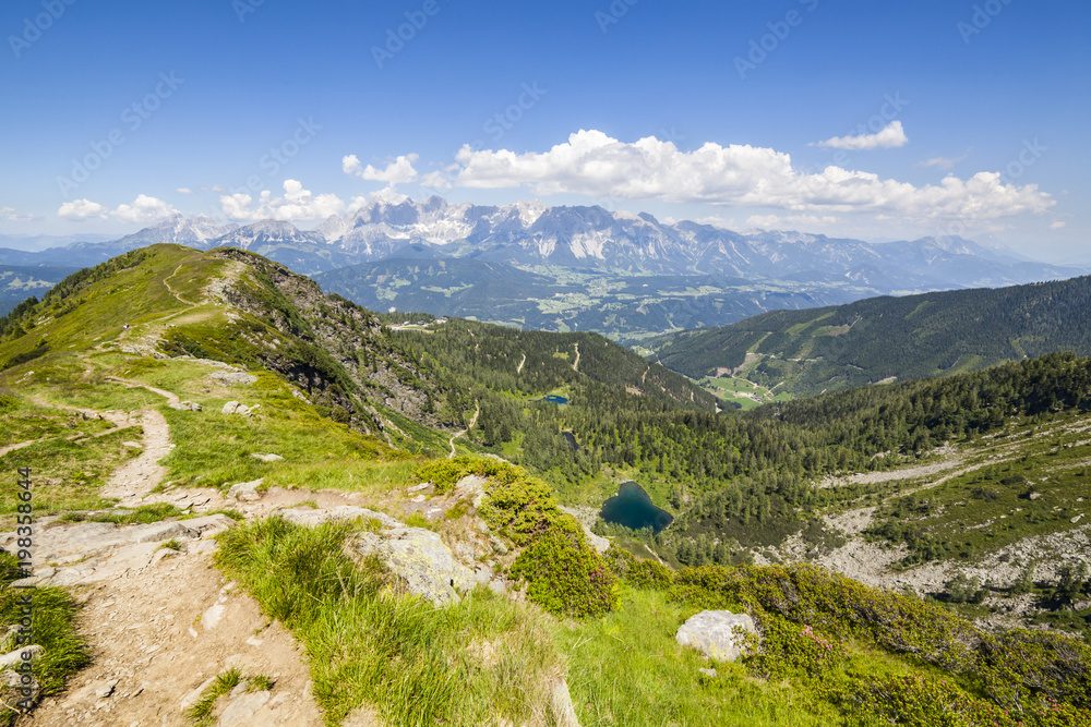 Trail from mountain Gasselhoehe to Rippetegg with  lakes and Dachstein
