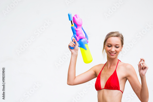 Bikini woman with water gun