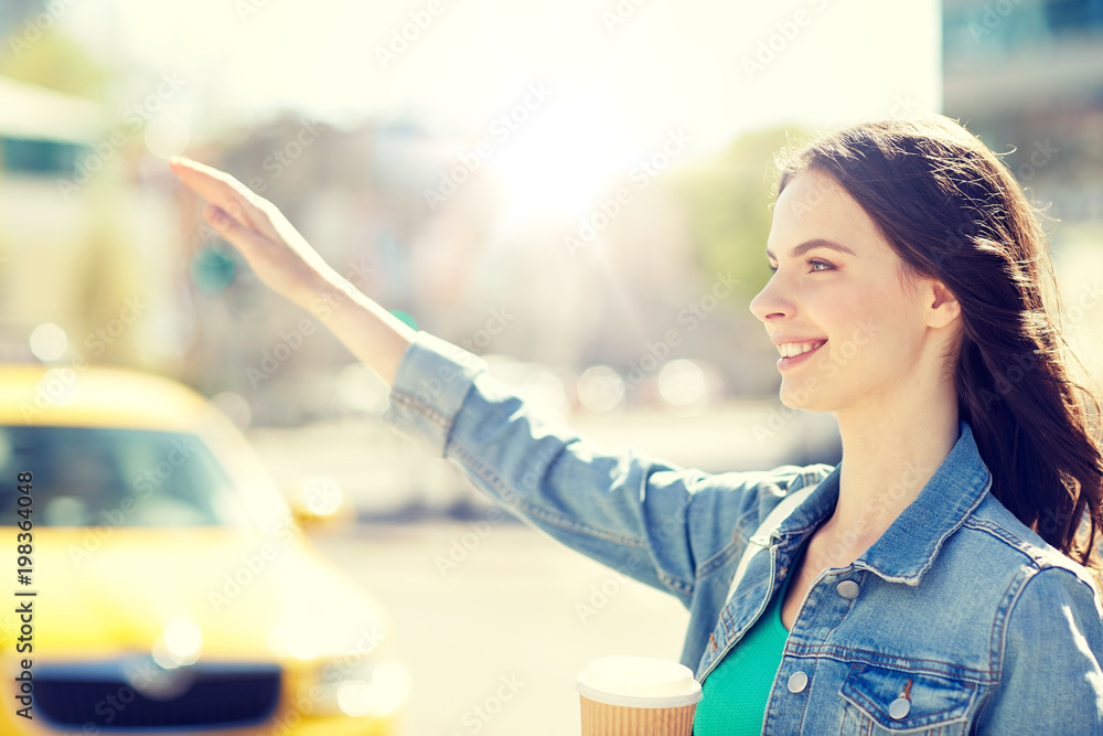 gesture, lifestyle, travel and people concept - happy young woman or teenage girl drinking coffee from paper cup on city street gesture, lifestyle, travel and people concept - happy young woman or teenage girl drinking coffee from paper cup on city street