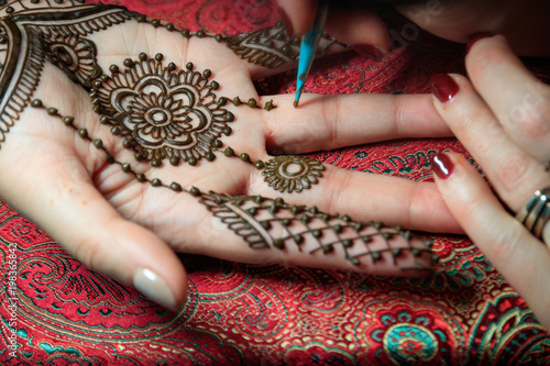 North America, USA, Washington. Indian Mehendi celebration.  Henna application and rituals. Hand. photo
