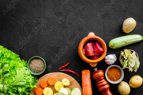 ingredients for vegetable ragout cooking on stone table background top view mock-up
