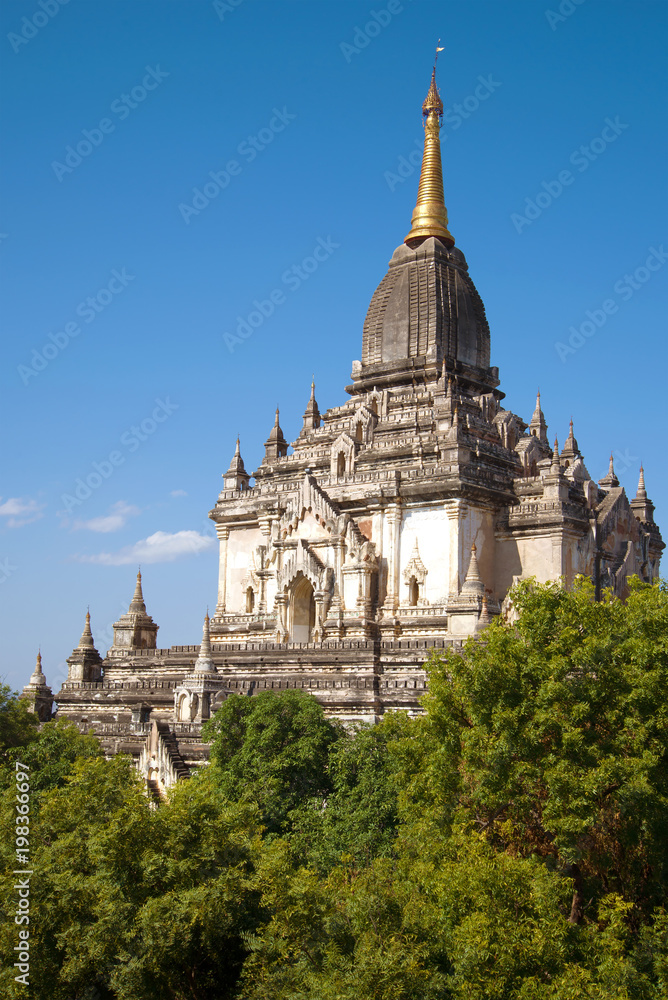 The peak of the ancient Buddhist temple of Gawdaw Palin on a sunny day. Bagan, Myanmar The peak of the ancient Buddhist temple of Gawdaw Palin on a sunny day. Bagan, Myanmar