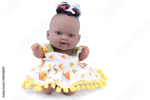 Rubber plastic doll of a afro black baby isolated in white background